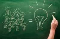 light bulbs sketched on chalkboard Many small ideas make a big one